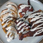 smoked chicken with alabama white sauce on on a plate