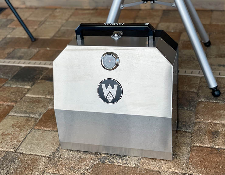 a side view of the Magma Crossover grill top with handle on top