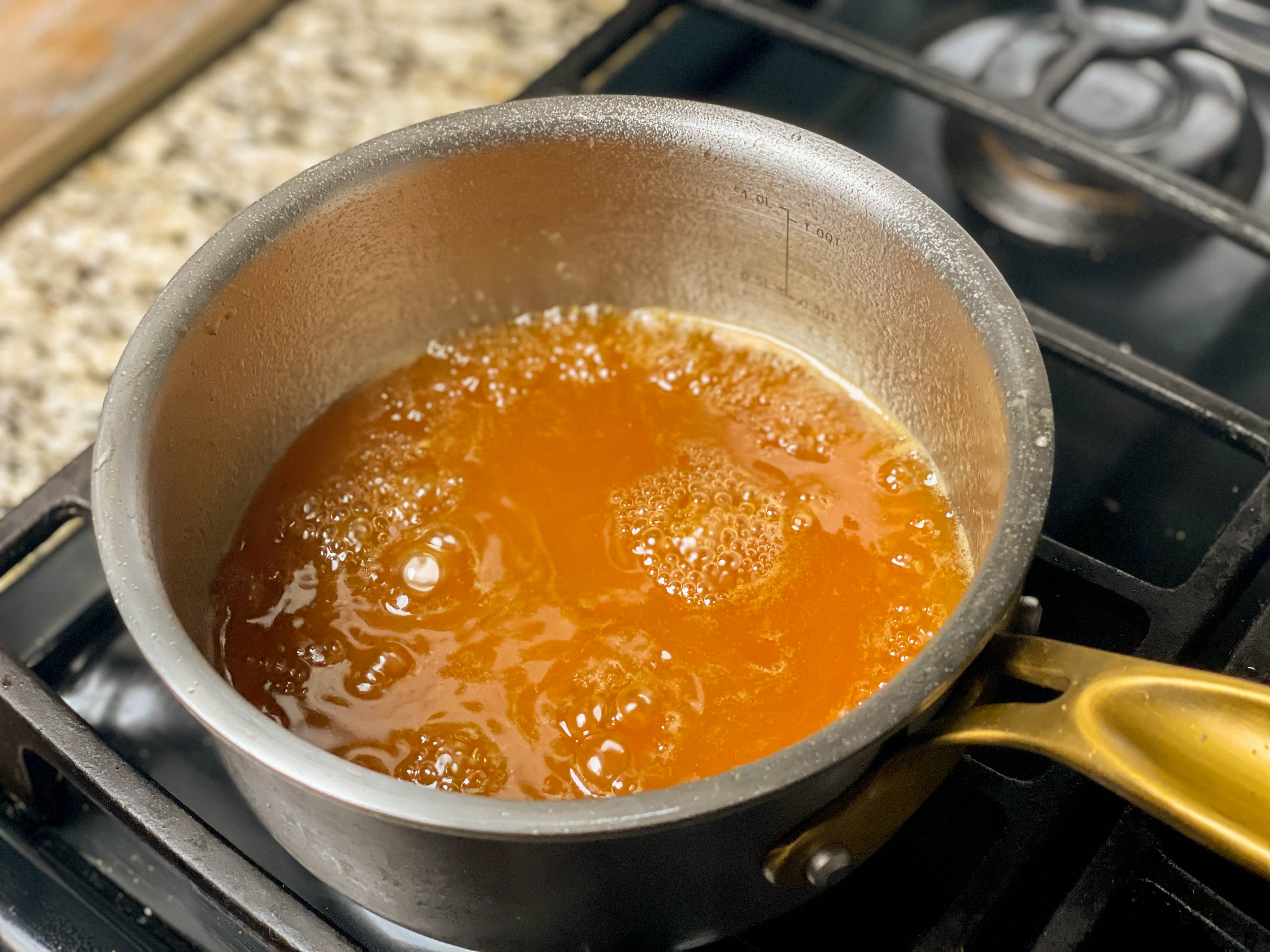 pot of maple bourbon glaze simmering
