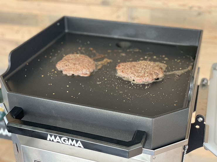 two smash burger patties in Magma Crossover griddle top