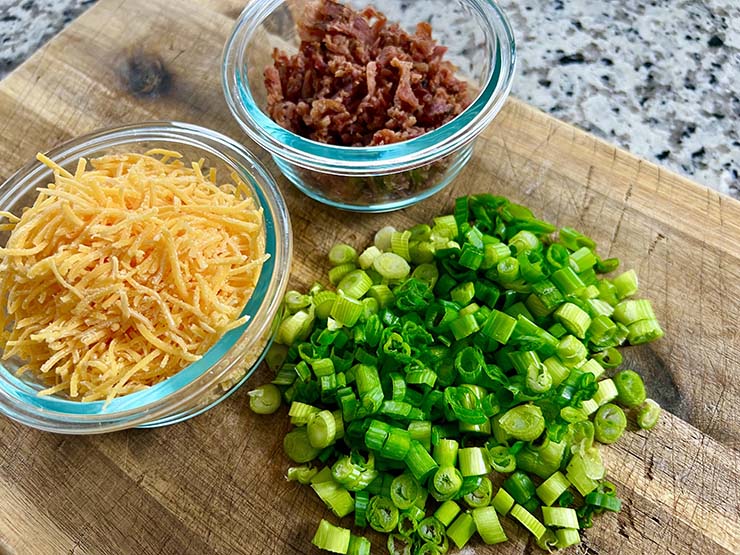 shredded cheddar cheese, crumbled bacon and chopped green onions