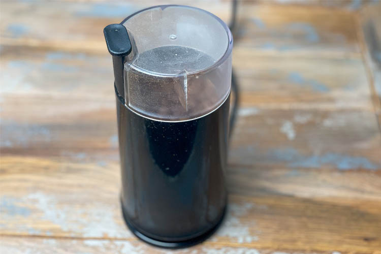 coffee grinder on a wooden board