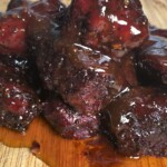 smoked poor man's burnt ends on a wooden board