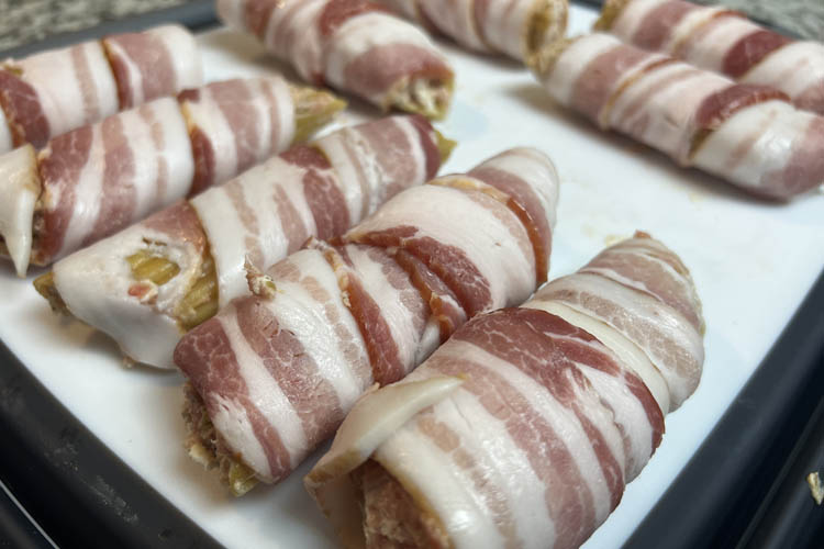 raw jalapeno popper shotgun shells on a white plate