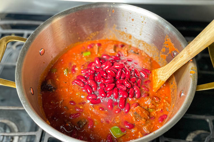 brisket chili with kidney beans on top in a silver pot