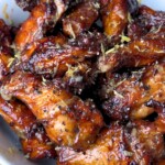 smoked lemon pepper wings on a white plate