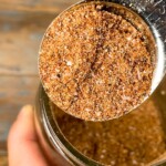 metal spoon with with dry rub for ribs