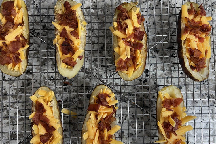 fillled potatoe skins on wire rack prior to cooking