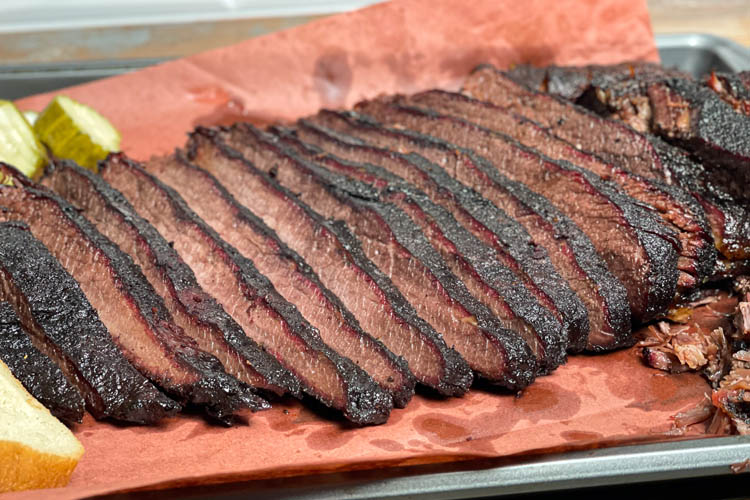 piece of sliced up brisket on buther paper