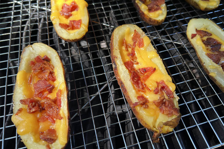 potatoes skins cooking on the grill