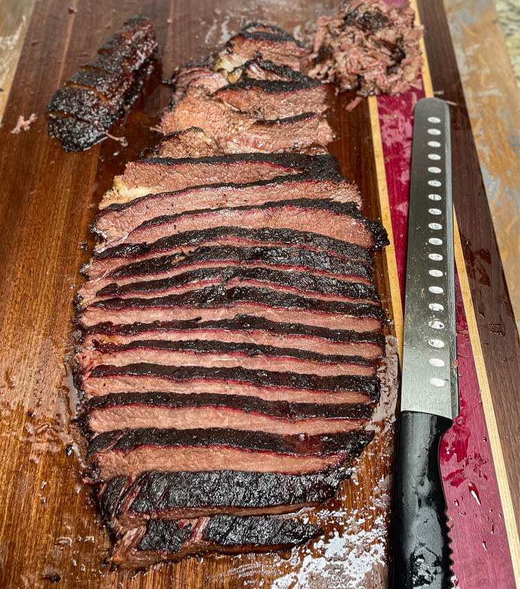 sliced brisket on chopping board