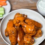 smoked buffalo hot wings on a white plate