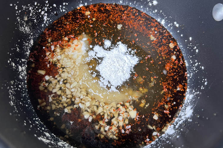honey garlic sauce ingredients in a saucepan