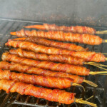 bacon wrapped carrots with maple glaze on the grill