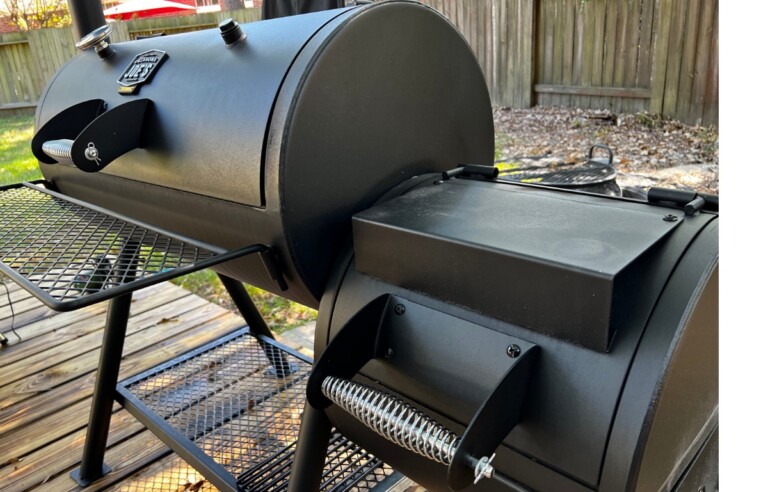 oklahoma joe's offset smoker on wood patio