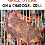 uncooked seasoned steak on a charcoal grill