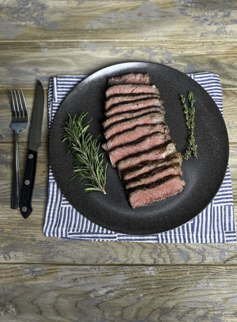 sliced steak served on plate