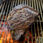 ribeye steak on a charcoal grill