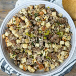 smoked sausage stuffing in a white bowl
