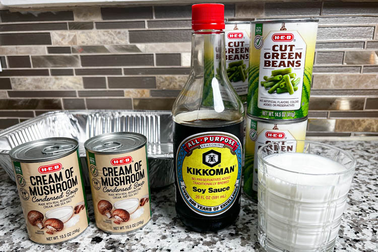 can of beans, can of mushroom soup, bottle soy saue, jug of milk