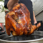 lifting deep fried turkey out of fryer