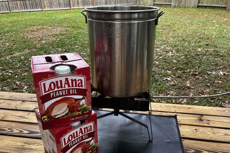 pot and burner and two boxes of peanut oil