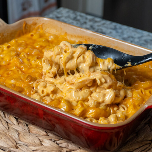 dish of smoked mac and cheese with spoon scoping some out