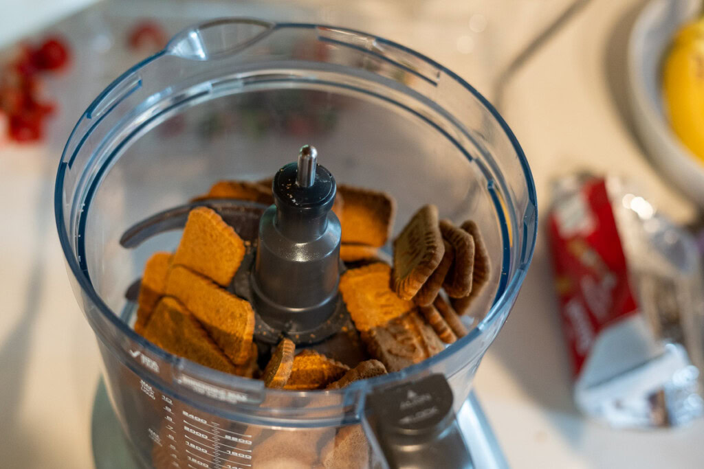 whole biscoff biscuits in the bowl of a food processor