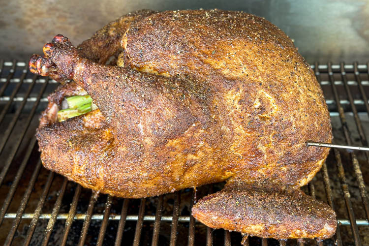 turkey cooking on the grill