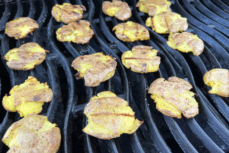 cooked smashed potatoes on the grill