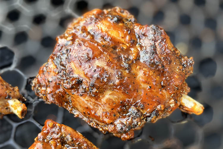 glazed pig wing on the grill