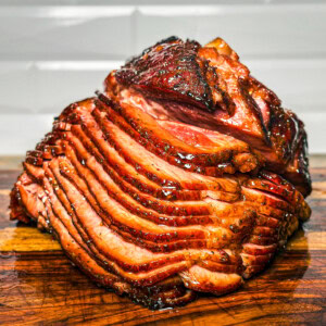 a twice smoked ham on a wooden board