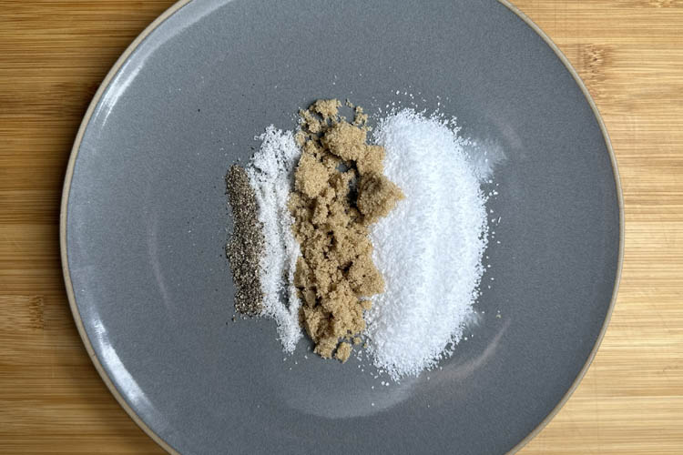 salt, brown sugar and pink curing salt on a grey plate 
