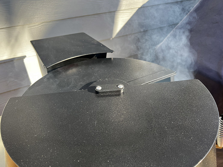 smoke coming from the Grilla Grills Alpha Connect pellet grill