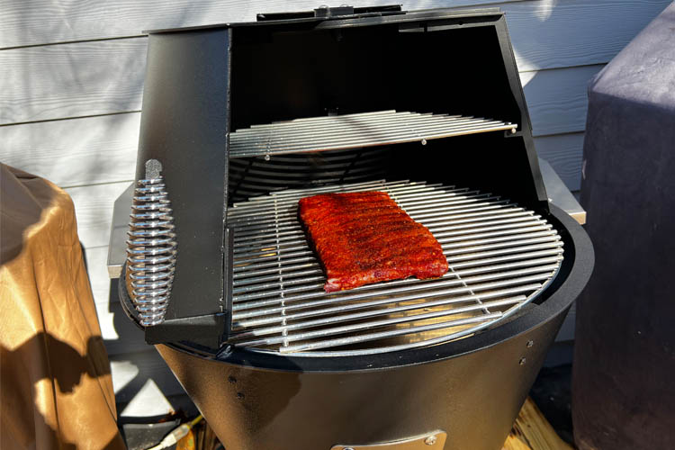 raw pork ribs in the smoker