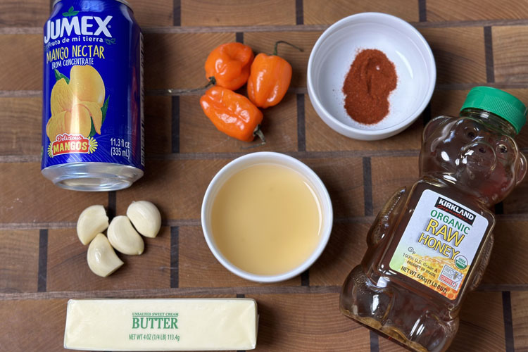mango habanero sauce ingredientson wooden board
