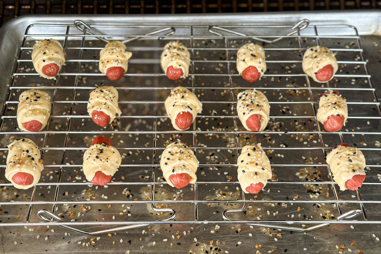 pigs in blanket on a wire rack 15 minutes into the cook