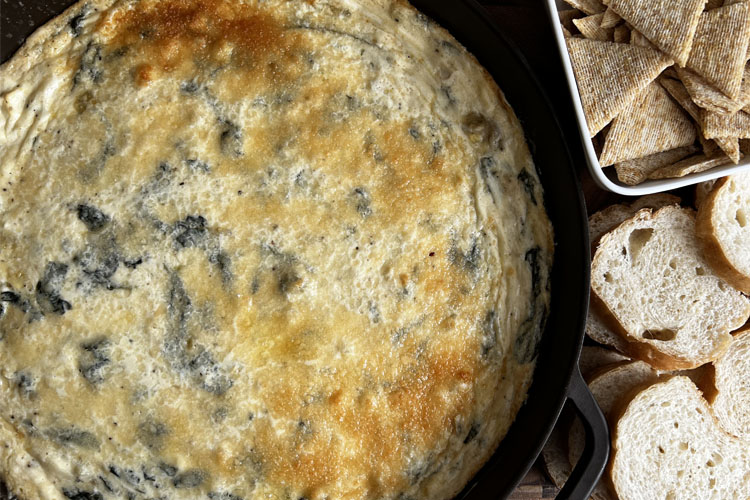 smoked spinach dip with crackers and crostini