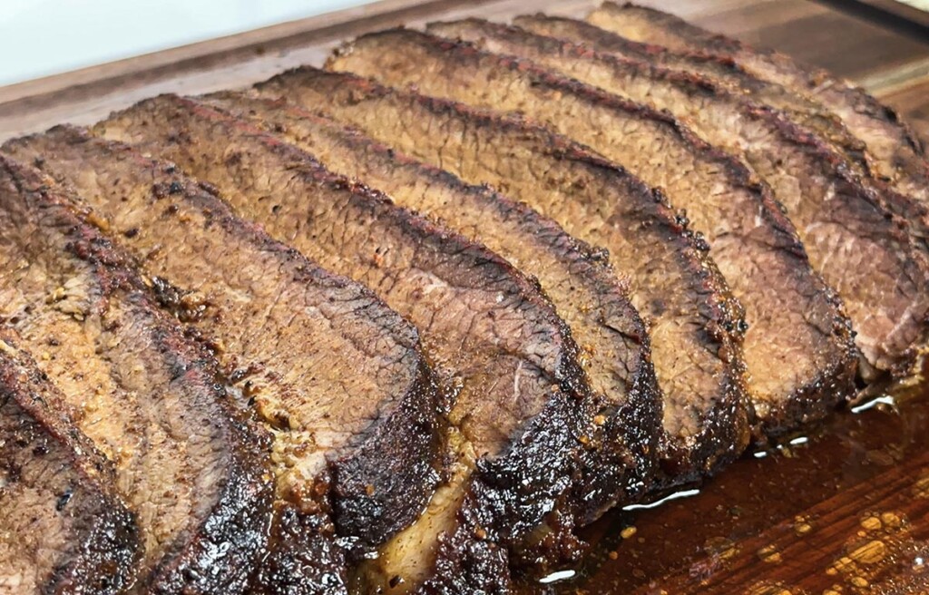 sliced smoked brisket cooked in an electric smoker