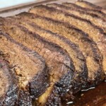 sliced smoked brisket cooked in an electric smoker