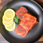 pellet grill hot smoked salmon fillets on a dark plate