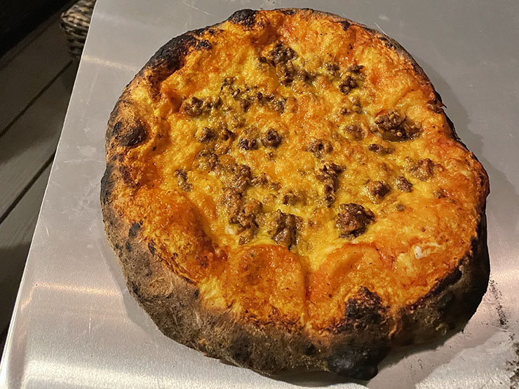 pizza on a steel pizza peel