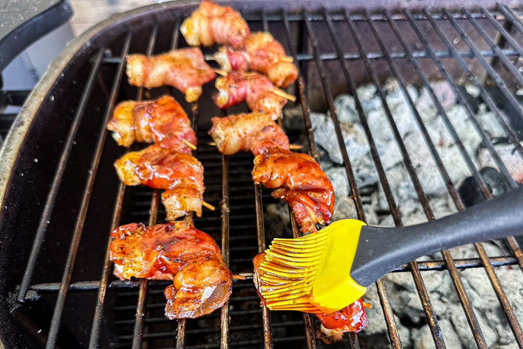 shrimp on the grill being basted