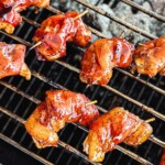 bacon wrapped shrimp on a charcoal grill