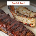 grilled NY strip steak and two lobster tails on a white plate
