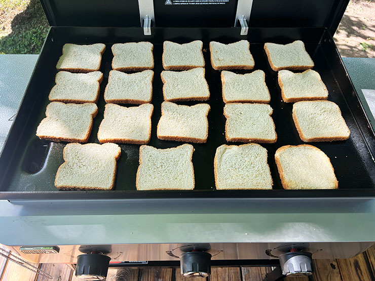 uncooked pieces of bread on Weber Griddle