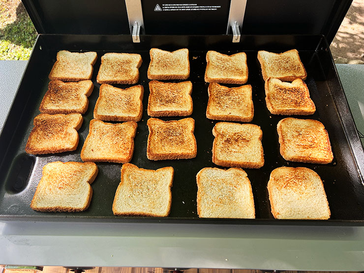 toasted pieced of bread on Weber Griddle