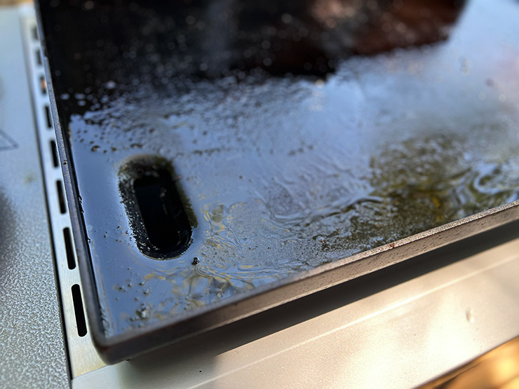 a close up view of the Weber Griddle grease trap