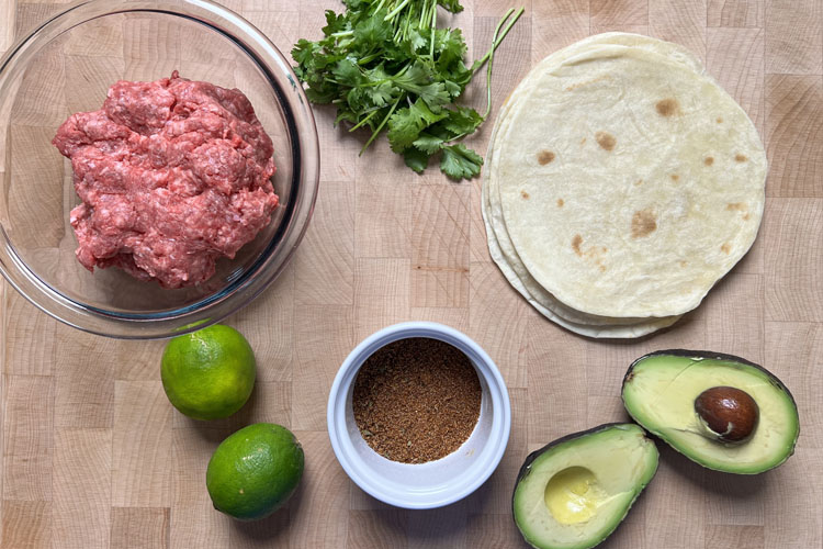 smashburger taco ingredients on a wooden board