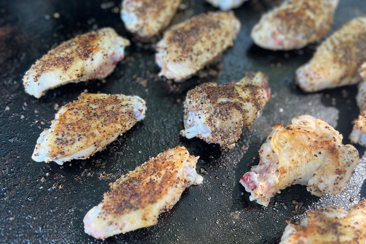 cooked wings on the griddle